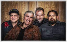 A photo of four band members posted together.