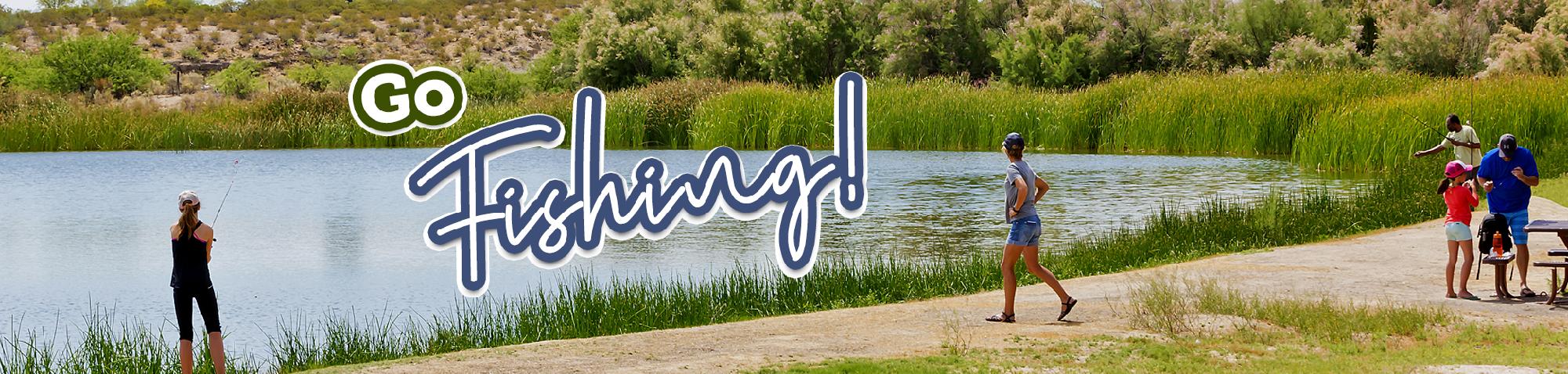 Park visitors fishing and enjoying a bright sunny day from the shore of a cattail lined Dankworth pond.