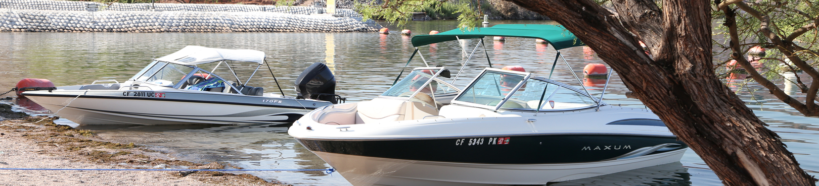 Two ski boats pulled up the the beach and tied off at Cattail Cove State Park.