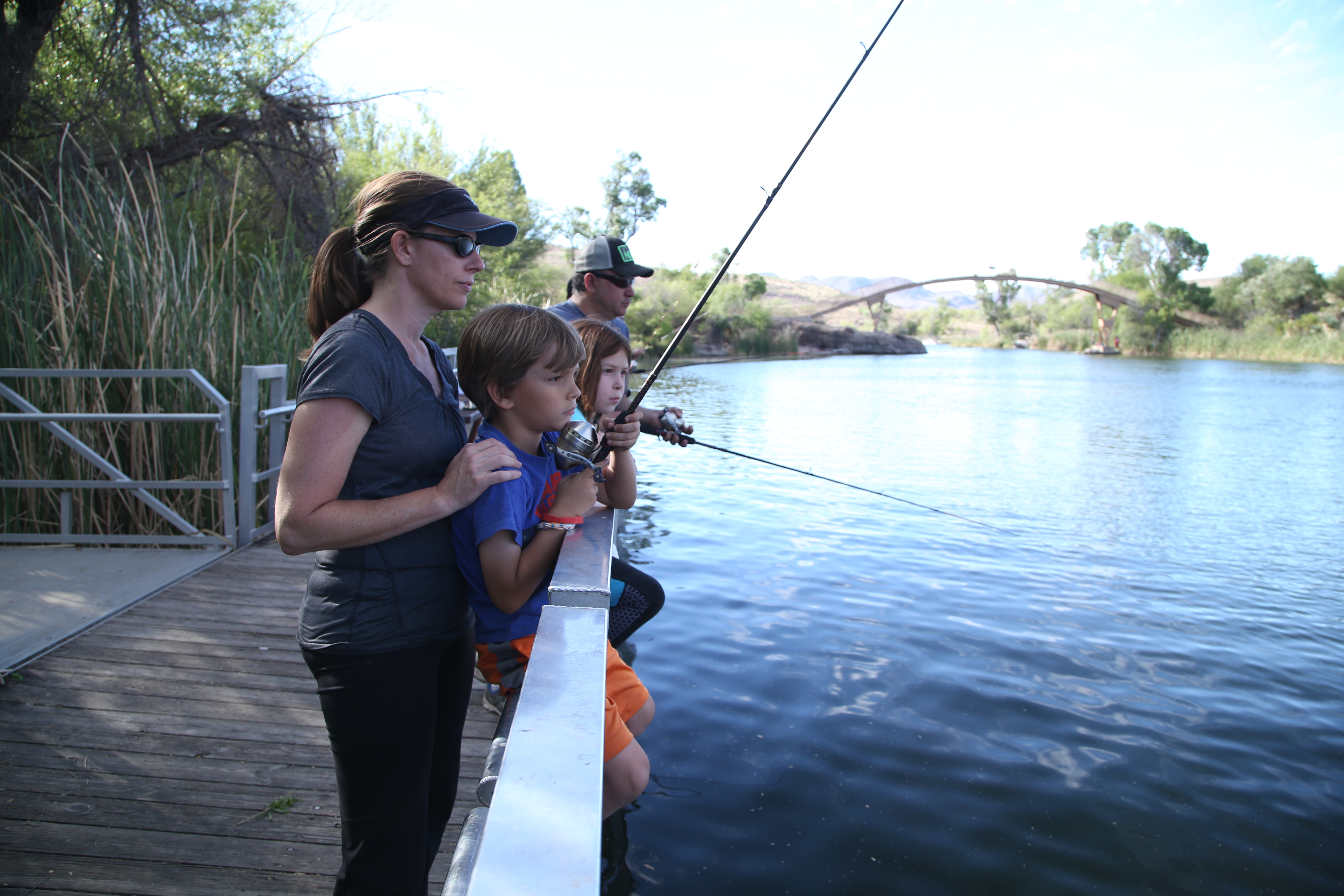 A mom and child fishing during a Family Campout weekend at Patagonia Lake State Park