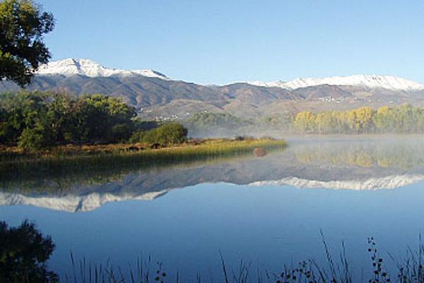 Mountains topped with snow behind the lagoons at Dead Horse Ranch