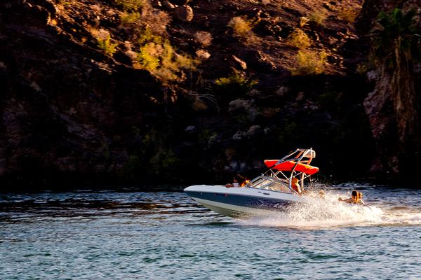 A boat speeds along the water