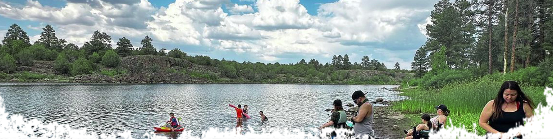 A family plays in the water at Fool Hollow Lake Recreation Area